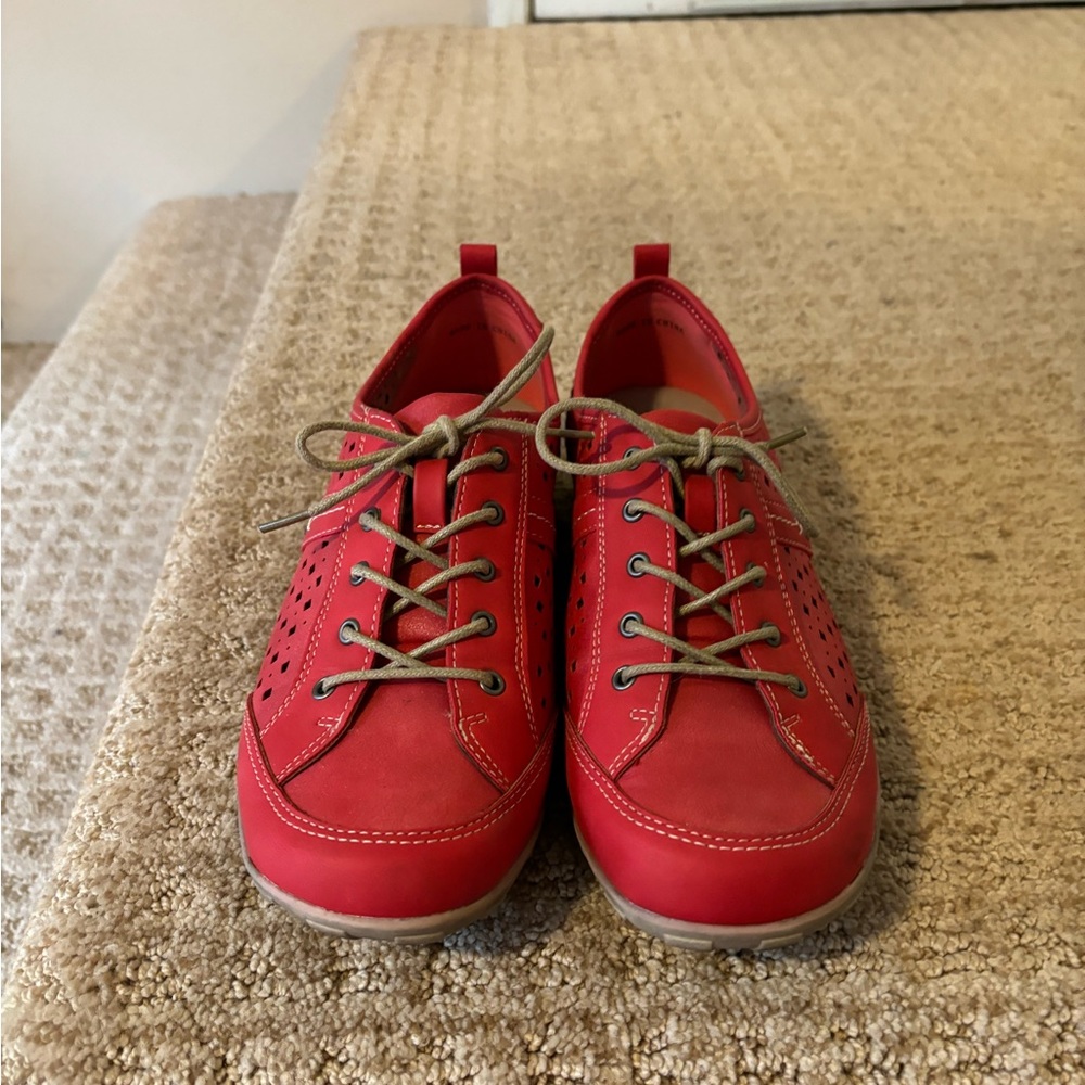Red perforated lace up sneakers